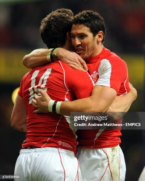 Wales' George North is congratulated by team mate James Hook after runs in to score his side's first try on his international debut
