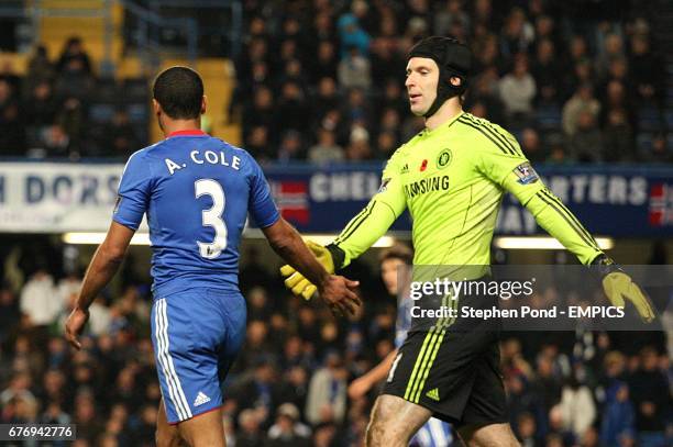 Chelsea's Ashley Cole is consoled by goalkeeper Petr Cech after his pass-back lead to the concession of their third goal, scored by Sunderland's...