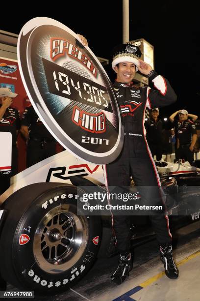 Helio Castroneves of Brazil, driver of the Team Penske Chevrolet celebrates after winning the Verizon P1 Pole Award and earning 'speed king' title...