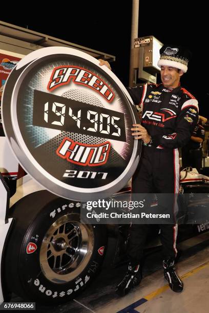 Helio Castroneves of Brazil, driver of the Team Penske Chevrolet celebrates after winning the Verizon P1 Pole Award and earning 'speed king' title...