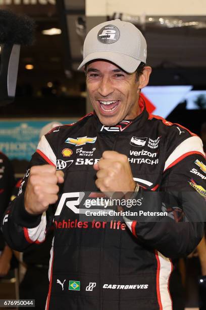 Helio Castroneves of Brazil, driver of the Team Penske Chevrolet celebrates after winning the Verizon P1 Pole Award for the Desert Diamond West...