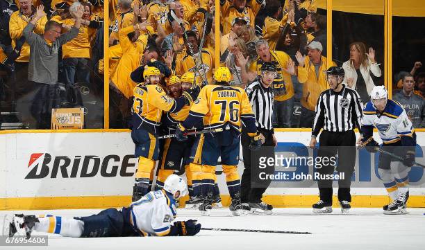 Ryan Ellis of the Nashville Predators celebrates his goal with Filip Forsberg, Mike Fisher and Colin Wilson against the St. Louis Blues in Game Four...