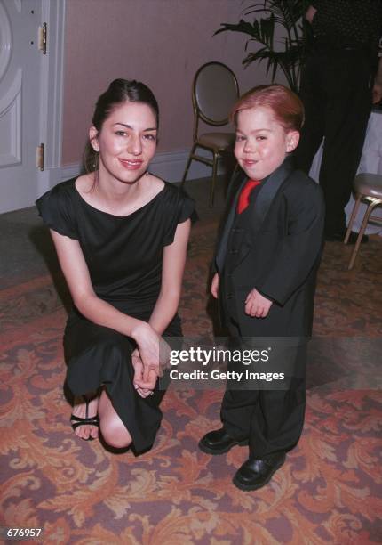 Director Sofia Coppola poses with actor Josh Ryan Evans at The Fifth Annual Golden Satellite Awards January 14, 2001 in Beverly Hills, CA.