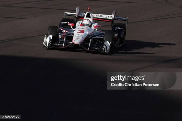 Helio Castroneves of Brazil, driver of the Team Penske Chevrolet drives during practice for the Desert Diamond West Valley Phoenix Grand Prix at...