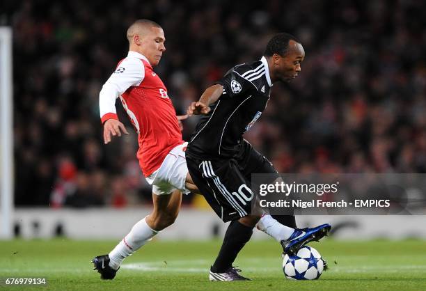 Arsenal's Kieran Gibbs and Partizan Belgrade's Almani Moreira battle for the ball