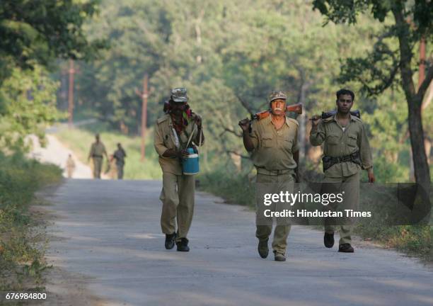 Naxals Menace in Dantewada District police officers patrolling the naxal infested forests at Bijapur near Dantewada.