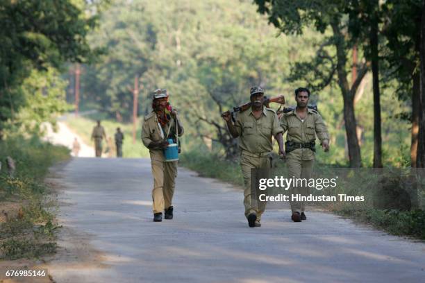 Naxals Menace in Dantewada District police officers patrolling the naxal infested forests at Bijapur near Dantewada.