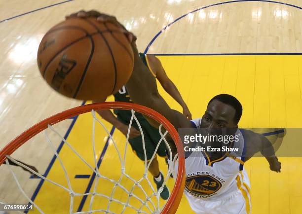 Draymond Green of the Golden State Warriors dunks against Boris Diaw of the Utah Jazz during Game One of the NBA Western Conference Semi-Finals at...