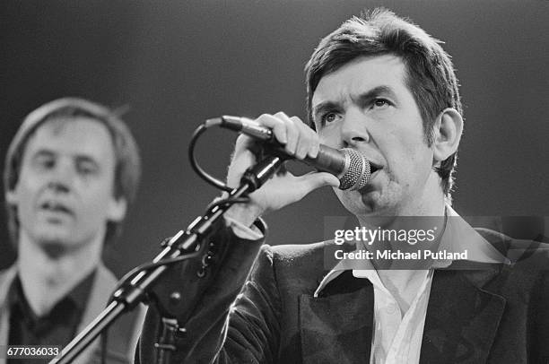 English musician Ronnie Lane performing on stage at a charity concert for ARMS , held at the Royal Albert Hall, London, 20th September 1983. Lane, a...