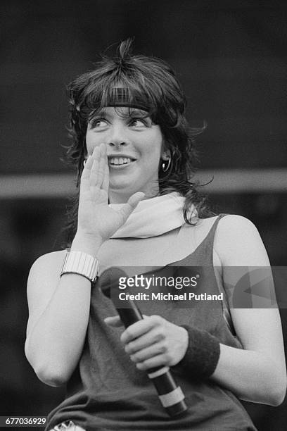 German singer Nena performing with her band, of the same name, at Werchterpark, Werchter, Belgium, 10th June 1983.