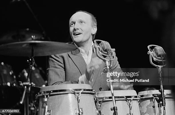 English percussionist Ray Cooper performing on stage at a charity concert for ARMS , held at the Royal Albert Hall, London, 20th September 1983.