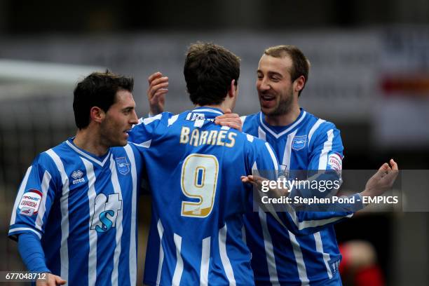 Brighton & Hove Albion's Ashley Barnes celebrates scoring with team mates