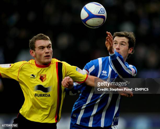 Brighton & Hove Albion's Ashley Barnes and Watford's Lee Hodson in action