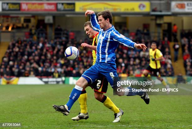 Brighton & Hove Albion's Ashley Barnes and Watford's Lee Hodson in action