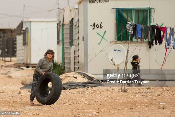 Schools run by NGO's inside Zaatari often have to run two sessions a day to accomadate the growing number of children. While not in school children...
