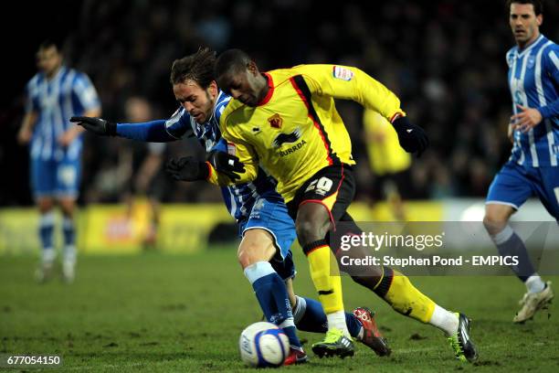 Watford's Marvin Sordell and Brighton & Hove Albion's Inigo Calderon compete for the ball