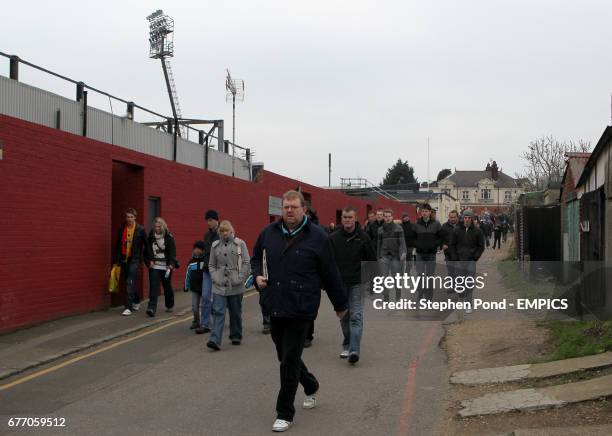 General view of fans walking past Vicarage Road Stadium.