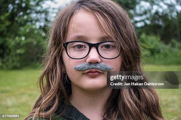 uoung girl with fake moustasches - role reversal stock pictures, royalty-free photos & images