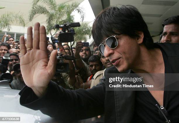 Bollywood star Shah Rukh Khan waves upon his arrival from the U.S. At the Mumbai international airport August 18, 2009. Khan one of India's best...