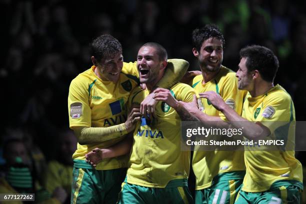 Norwich City's Henri Lansbury celebrates scoring his sides' second goal with team mates Grant Holt Andrew Surman and Russell Martin