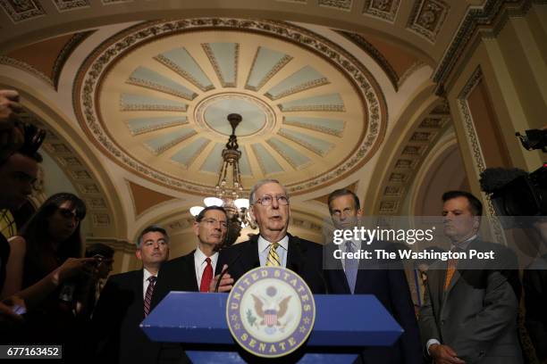 Senate Majority Leader Mitch McConnell of Ky., accompanied by, from left, Sen. Cory Gardner, R-Colo., Sen. John Barrasso, R-Wyo., and Sen. John...