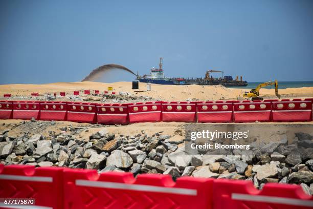 Dredging vessel operates at the construction site for the Colombo Port City development in Colombo, Sri Lanka, on Friday, April 21, 2017. Once fought...