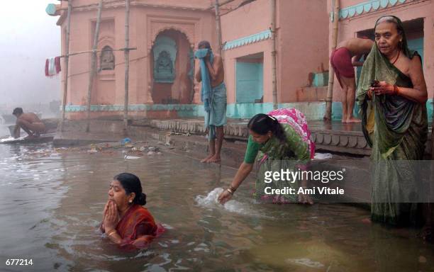 Indians bathe in the Ganges river in the early morning fog December 10, 2001 in Varanasi, India. The late George Harrison, a longtime devotee of...