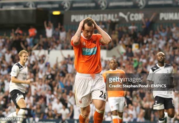 Blackpool's Charlie Adam reacts after having his penalty saved by Tottenham Hotspur's goalkeeper Gomes
