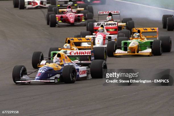 Nigel Mansell in the Williams-Renault, briefly behind teammate Riccardo Patrese at Copse, on his way to winning the British Grand Prix. Great...