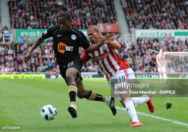 Stoke City's Jonathan Walters and Wigan Athletic's Maynor Figueroa battle for the ball