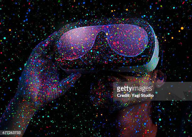 man using virtual reality headset with black light - creativity stock pictures, royalty-free photos & images