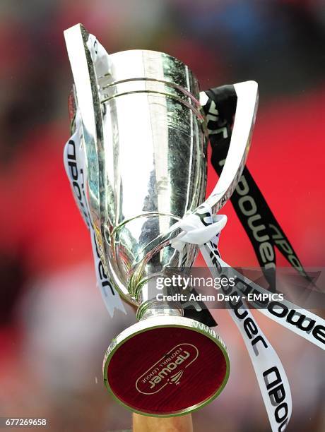 General view of the npower Championship Play-off trophy being held aloft by a Swansea City player