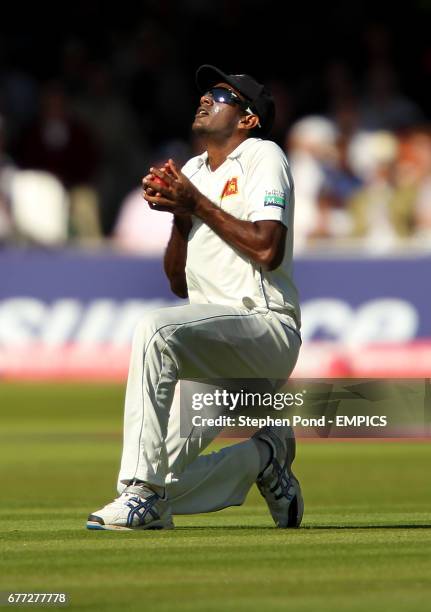 Sri Lanka's Farveez Maharoof catches England's Alastair Cook out for 96