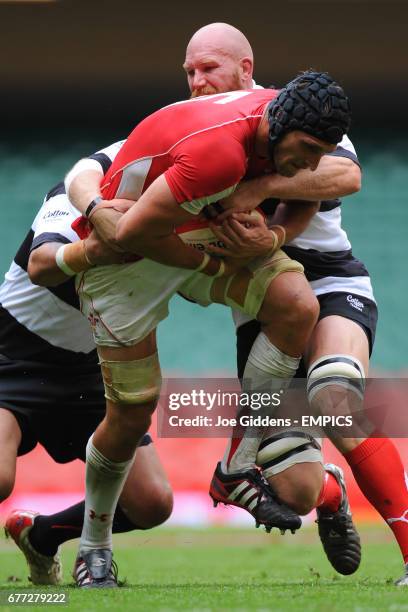 Wales' Luke Charteris is tackled by Barbarian's Erik Lund