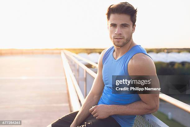 portrait of young men in sportoutfit - adult male vest exercise stock pictures, royalty-free photos & images