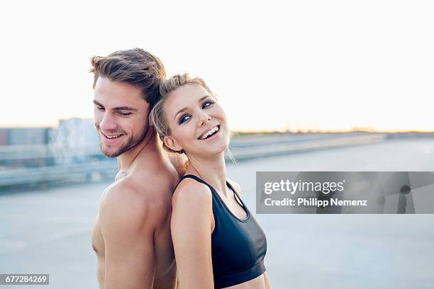 sporty couple laughing - philipp nemenz stock-fotos und bilder