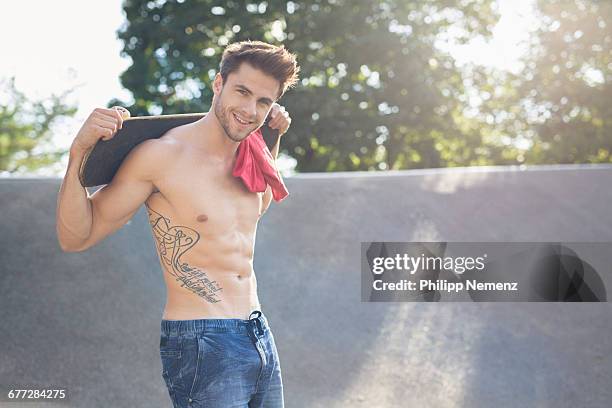 young tattooed man with skateboard - philipp nemenz bildbanksfoton och bilder