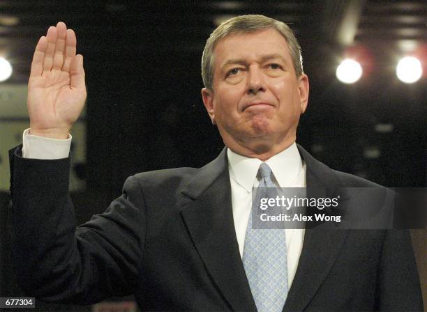 Attorney General-designate former Senator John Ashcroft is sworn in during the first day of his confirmation hearing January 16, 2001 on Capitol Hill...