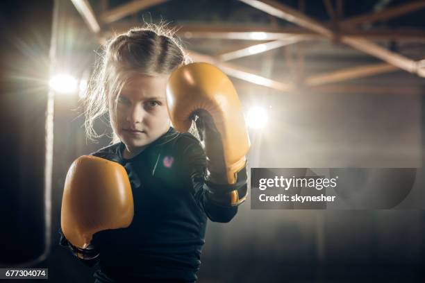 she is ready to knock out her opponent! - kids martial arts stock pictures, royalty-free photos & images