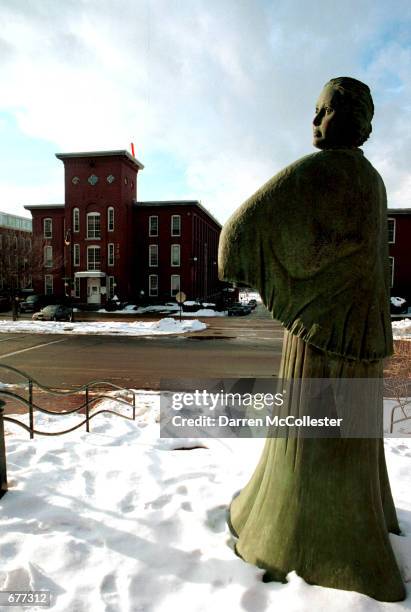 The sun reflects off Mill Girl statue January 16 which overlooks Amoskeag Millyards in Manchester NH. The old textile and fabrics buildings are now...