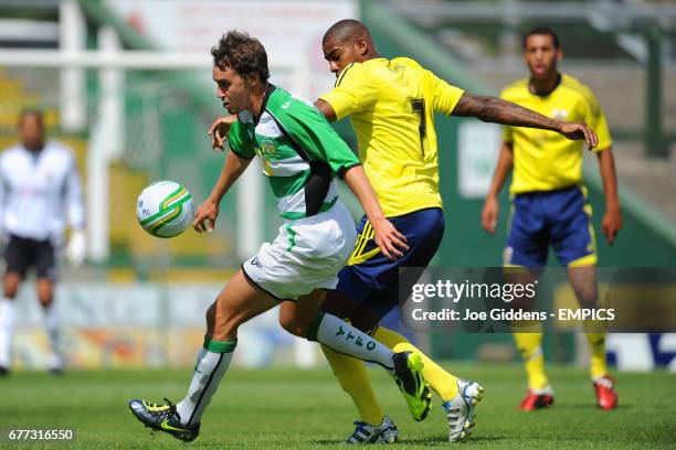 Yeovil Town's Ed Upson and Bristol City's Marvin Elliott