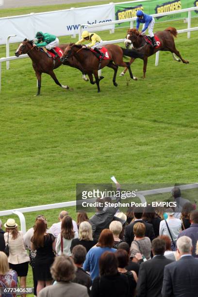 Punter watches his pick Archbishop ridden by Martin Dwyer come home to win the British Stallion Studs Supporting British Racing E.B.F. Maiden Stakes