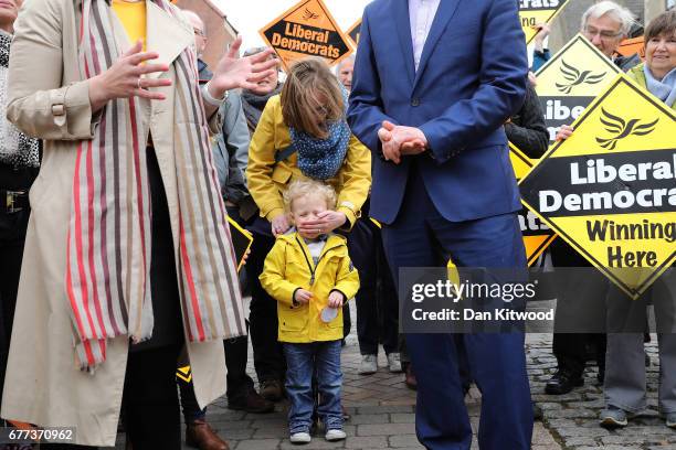 Angus Braden of Oxfordshire has to be stopped from shouting out and making everyone laugh by his mum as Liberal Democrat leader Tim Farron speaks...