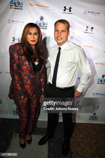 Tina Knowles Lawson and Shepard Fairey attend the 2nd Annual Art For Life Los Angeles at a private residence on May 2, 2017 in West Hollywood,...