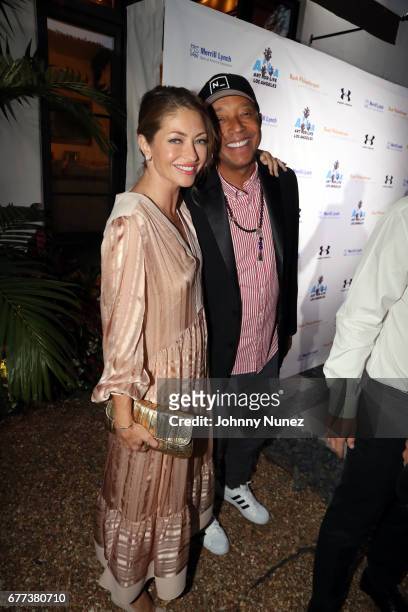 Rebecca Gayheart and Russell Simmons attend the 2nd Annual Art For Life Los Angeles at a private residence on May 2, 2017 in West Hollywood,...
