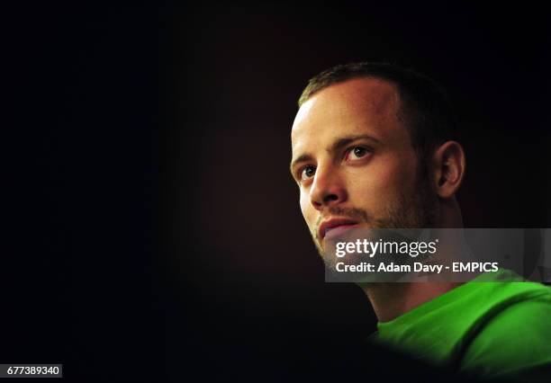 South Africa's Oscar Pistorius talks to the press during a press conference