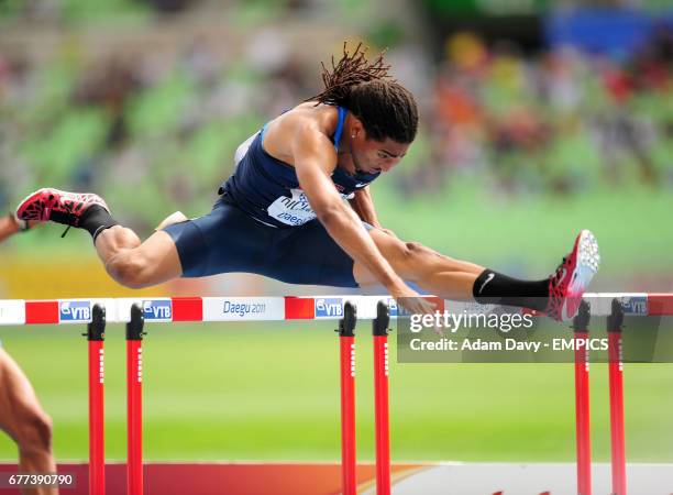 S Jason Richardson takes the last hurdle in the Men's 110m Hurdle