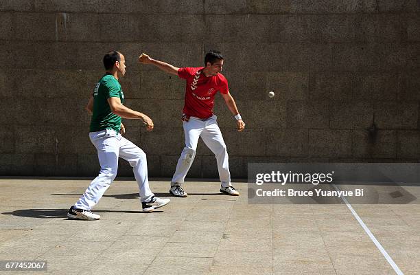 locals playing basque pelota on street court - cesta punta stock pictures, royalty-free photos & images