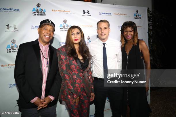 Russell Simmons, Tina Knowles Lawson, Shepard Fairey, and Tangie Murray attend the 2nd Annual Art For Life Los Angeles at a private residence on May...
