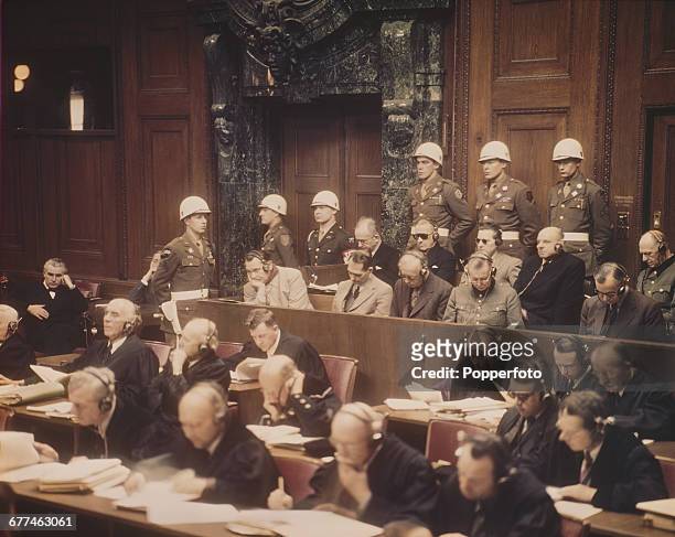 View of proceedings at the first Nuremberg trial with Nazi leaders pictured sitting in the dock before the International Military Tribunal at the...